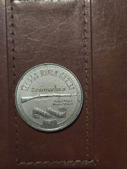 commemorative medal from the National Rifle Association (NRA) featuring the M1903 Springfield rifle. 