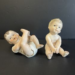 (2) 1950’s Bisque, Porcelain “Piano Baby” Figurines