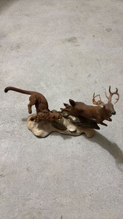 It is a resin sculpture "Hot Pursuit" by Danbury Mint,