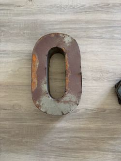 Rustic metal letter “O”