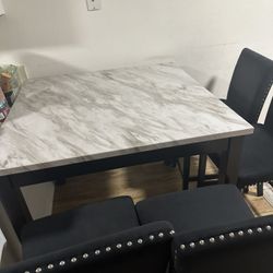 almost new counter table with 4 chair