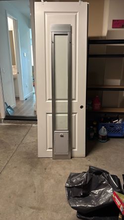 Cat door holder for sliding door area