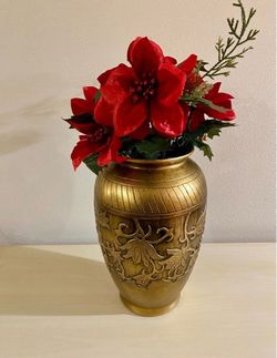 Gold tone pottery vase and silk flower decoration