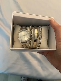 Silver watch and bracelets with decorative box