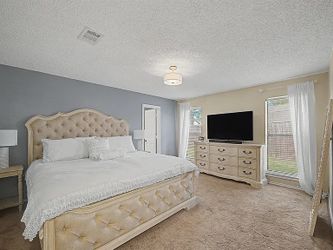 King size wood and upholstered bed with mattress and matching wood dresser for sale. Must go now!