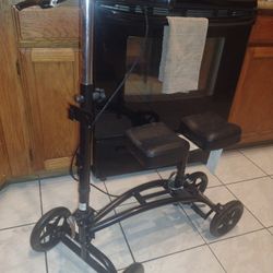 Black & Chrome, Knee Scooter. Easy Adjustable & Foldable Design. Comes without Basket. Duel Seat Padding. Only used once - Like New Condition.