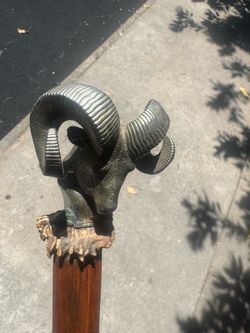 Beautiful handmade walking stick with a metal ram head