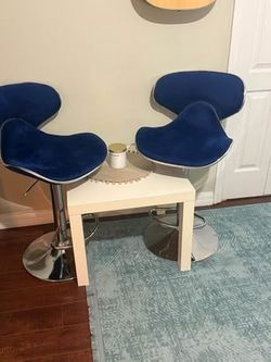 Roundhill Furniture Masaccio design featuring blue velvet upholstery and a chrome base.