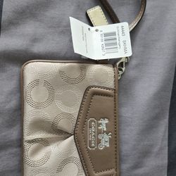 Coach wristlet in original packaging.