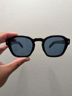 PRADA sunglasses with iconic metal plaque