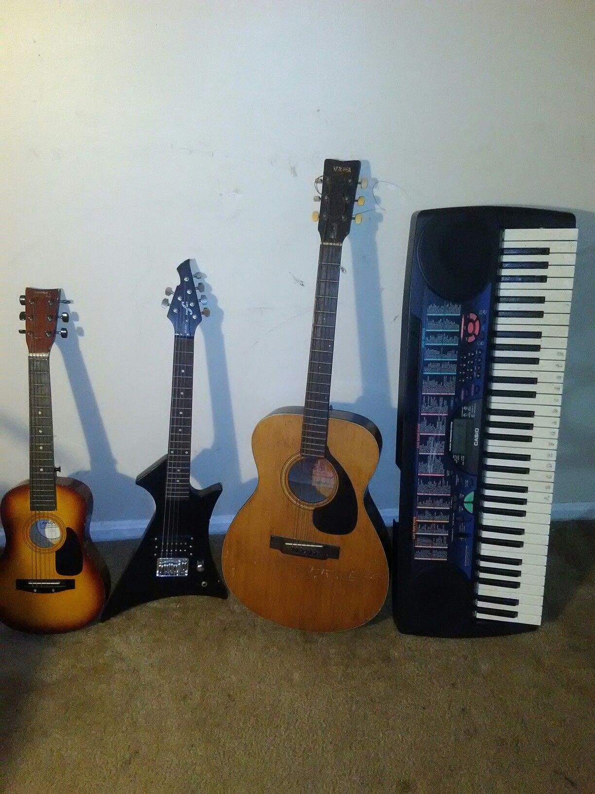 Guitars, a piano, amplifier and microphone