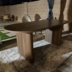 Modern Oval Wood Grain Dining Table and Chairs