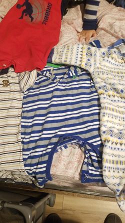 baby clothes of different sizes 1 dollar a piece shirts pants and rompers onesis 3 ... 6..9 .. months