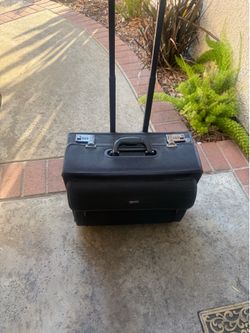 Rolling brief case with locks