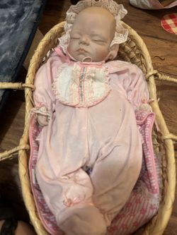 Doll In Basket