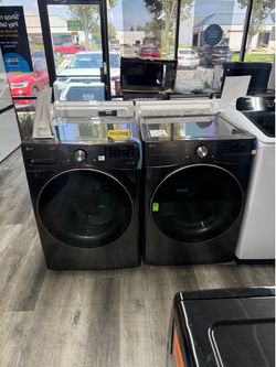 LG - 4.5 Cu Ft Stackable Front Load Washer With Steam Sanitize & 7.4 Cu Ft Smart Gas Dryer  Set in Black Steel 🔥