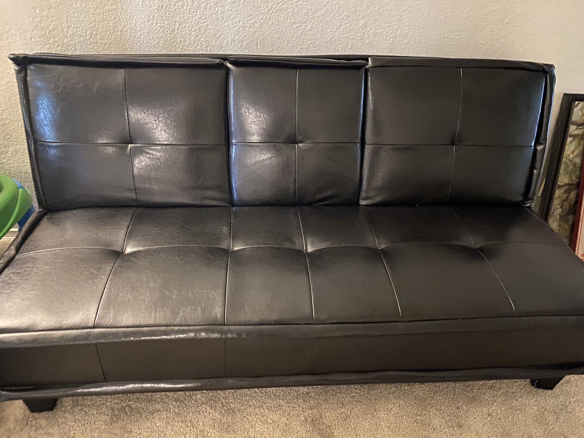 Black leather futon/bed couch