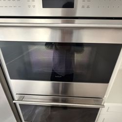 Sub Zero Refrigerator and Wolf Double Ovens and Wolf induction Cooktop 