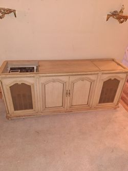 Vintage stereo cabinet with record player and speakers