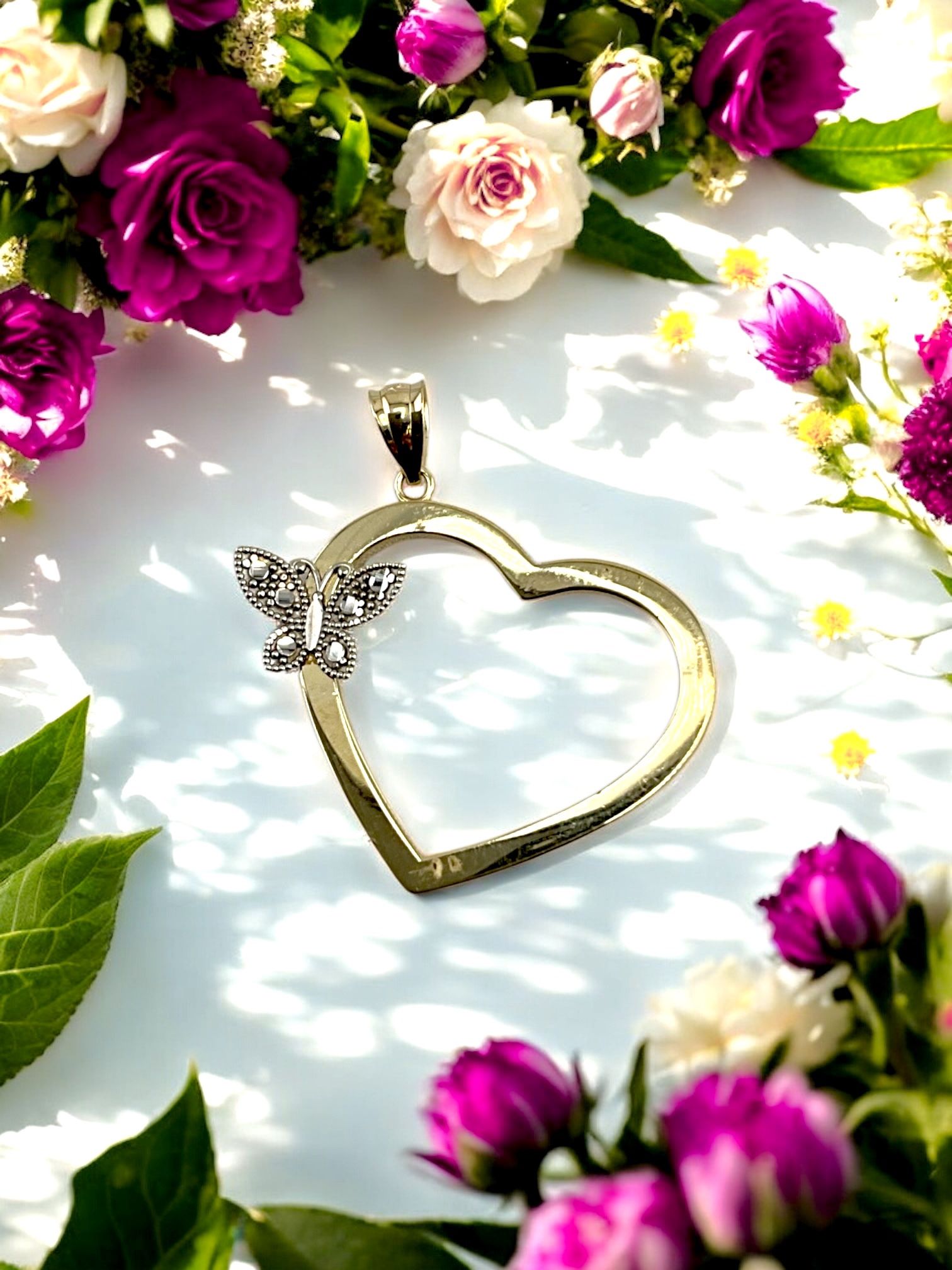 14kt 2.30g Two Tone Gold with Butterfly on Heart Pendant.