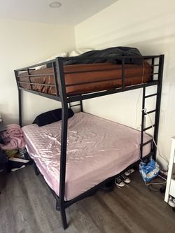 Full over Queen Bunkbed.  Bed was purchased new less than a year ago.  Sold with or without the mattress.  Bed located in Isla Vista.  Call Connie @ 7