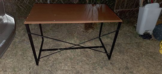 Table. Had sheving but no shelving included. Good for craft table or misc.