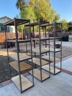 $50 each Heavy Duty Metal Storage Shelving Units (3) plus extra parts and shelves