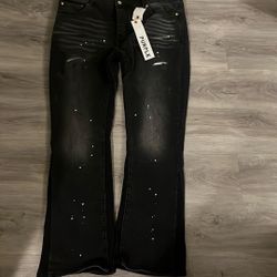 purple jeans black with white dots it does not have any rips 