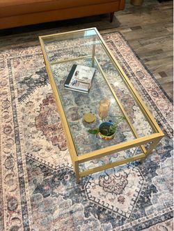 Glass coffee table with gold frame