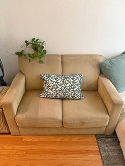 Beautiful tan loveseat sofa