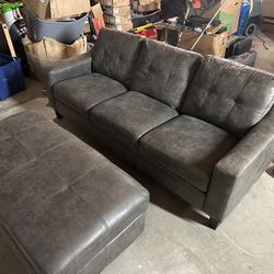 grey brand new small couch and ottoman in great condition 