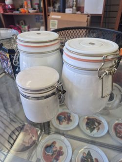 white milk glass jars feature clamp locking lids and orange rubber gaskets