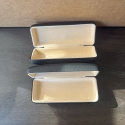 A Pair Of Eye Wear Cases By Vision Essentials 