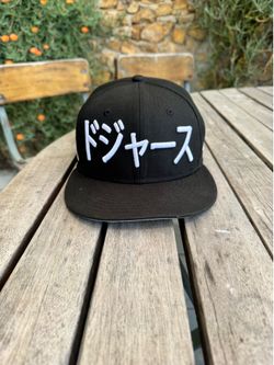 New Era Los Angeles Dodgers 9FIFTY snapback hat in black featuring Japanese writing on the front.