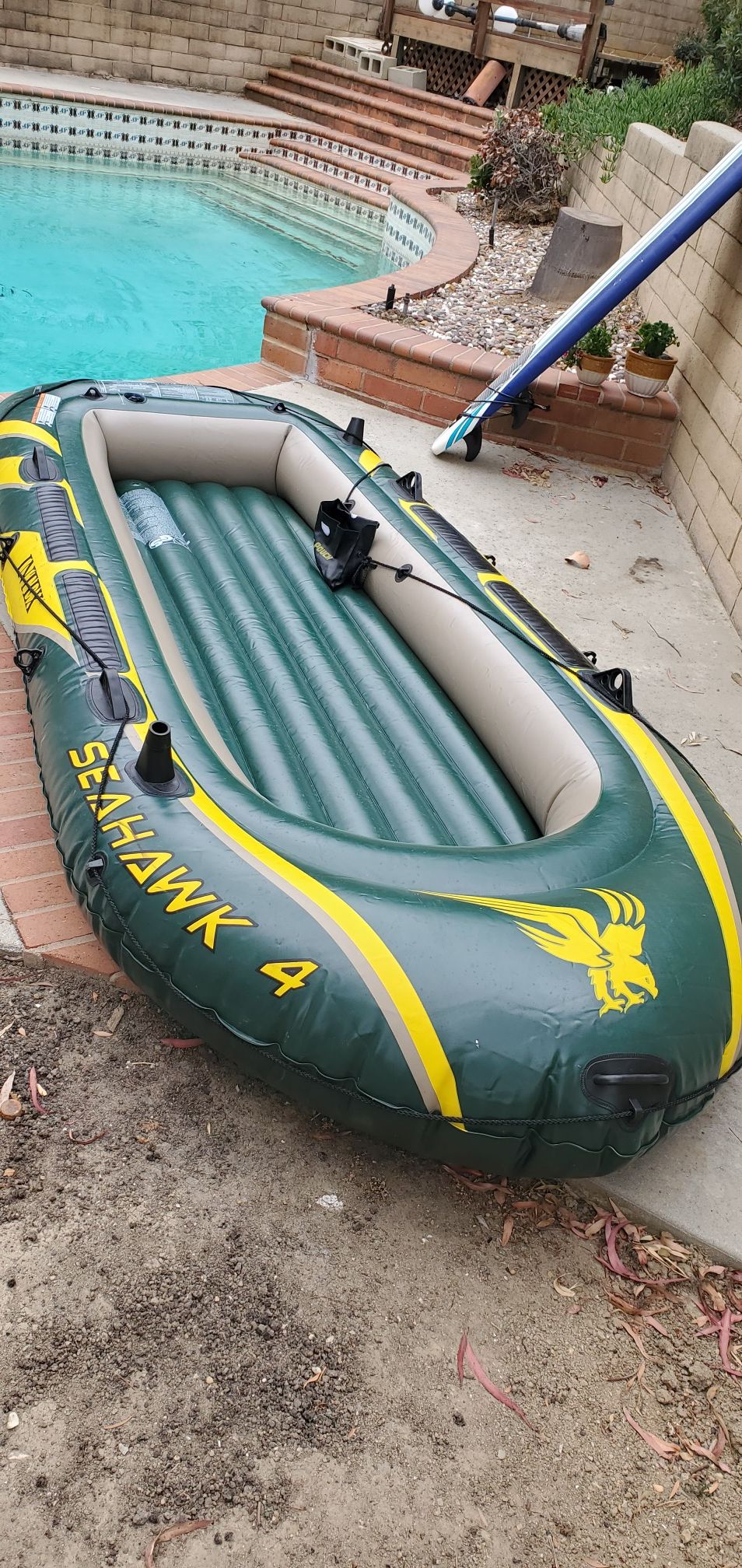 Inflatable boat with paddles