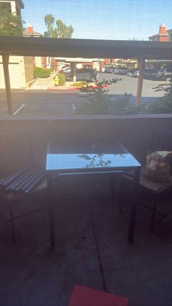 3 piece glass top outdoor dining set with woven seat chairs