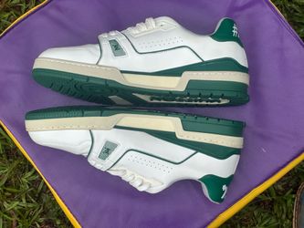 Louis Vuitton LV Trainer Sneakers in white and green.