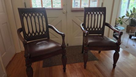 Carved wood side chairs - two