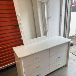 White dresser with mirror and lights