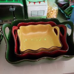 Set of three colorful wimsical Casserol dishes with handles.  