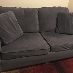 L-shaped couch with built-in folding bed