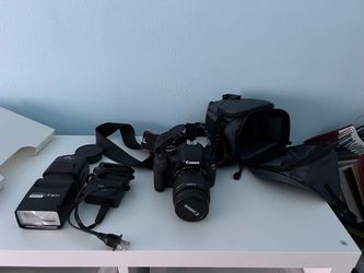 Canon Rebel camera, tripod, lights, backdrop stands and seamless rolls