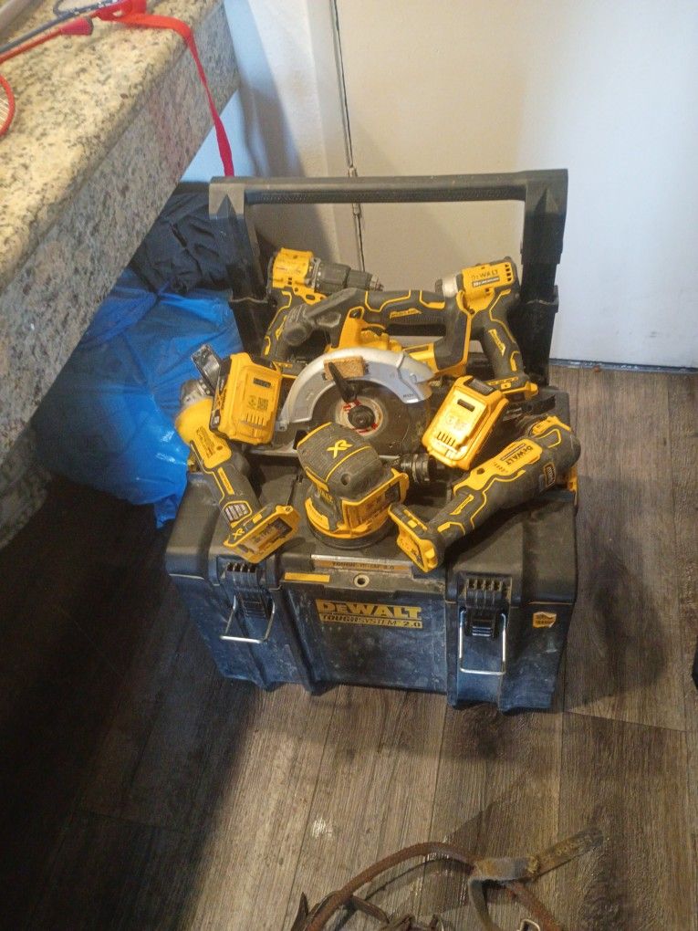 Complete DeWalt Tool Set That Comes With Grinder Two Batteries Pump Orbital Sander Circular Saw A Fine Cutting Tool Impact Gun And A Drill And A Charg