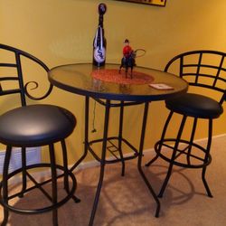 Tall Glass top table with 2 swivel stools
