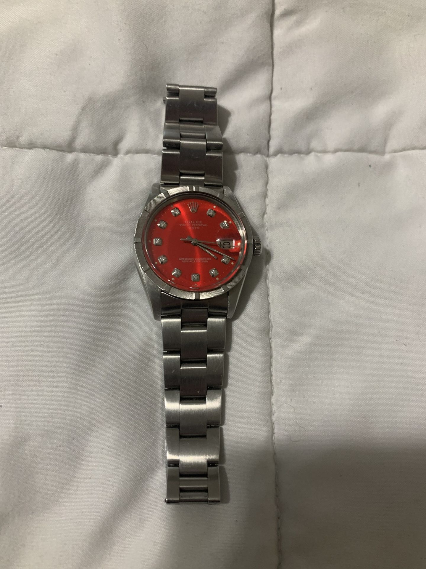 Authentic Rolex Stainless Steel Date Model. Full-size Bracelet . Oyster Perpetual. Red Diamond Dial . Read Ad. Firm Price