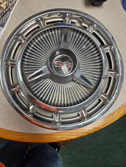 SS hubcap. 14" , slight curb rash