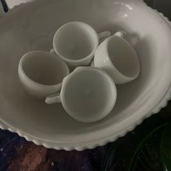 white punch bowl with four glasses