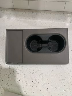 Ford jump seat cup holder
