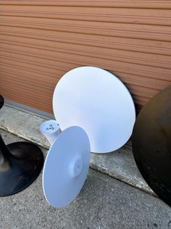 2 tables smaller white one med size black one very good condition with metal base plate heavy duty