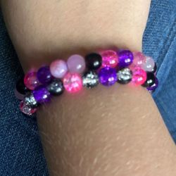 Pink and purple and black bracelets